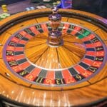 Brown and green round analog clock